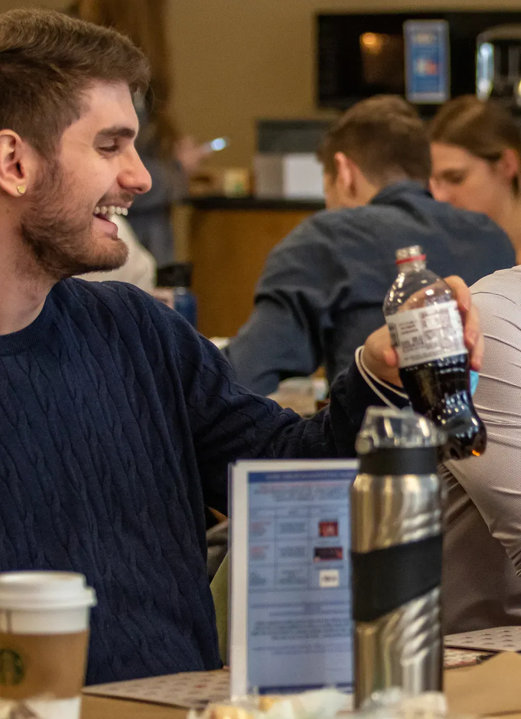 A student hold a soda during a lunch break in the Nor'easter Cafe