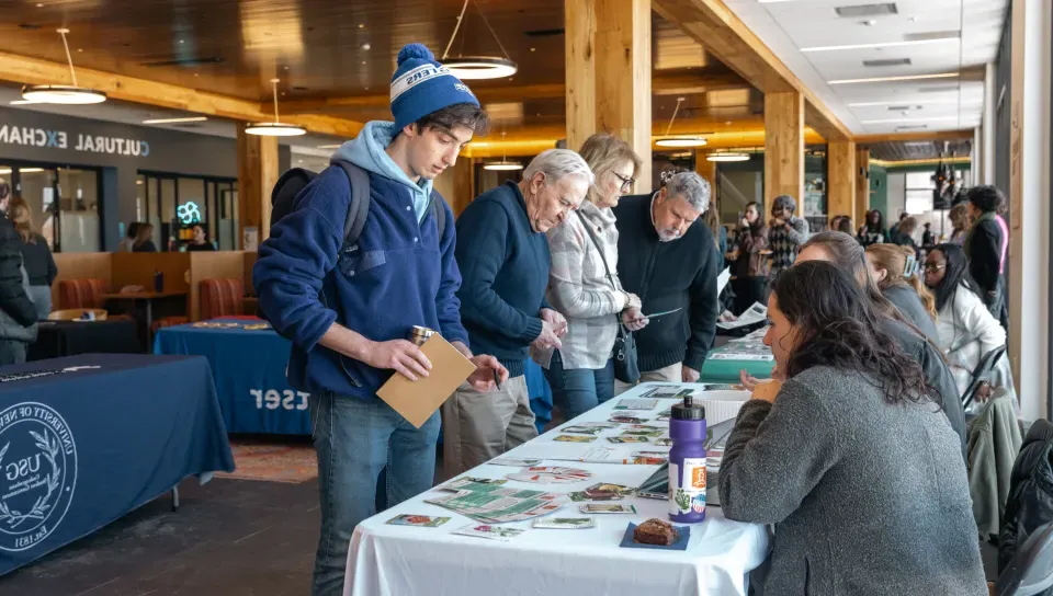 Students mingle at an organization fair in the Danielle N. Ripich Commons